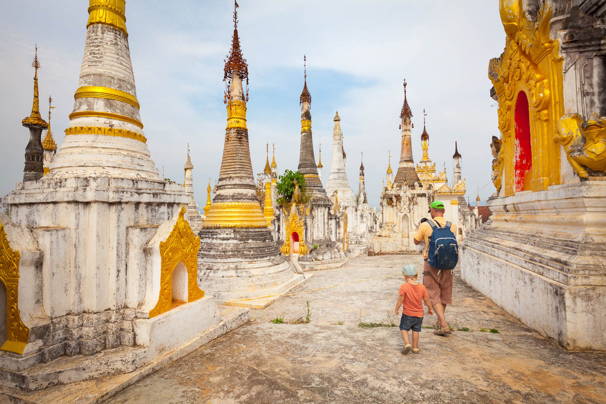 Family visiting buddhist temple Thaung Tho on Inle Lake. Myanmar.